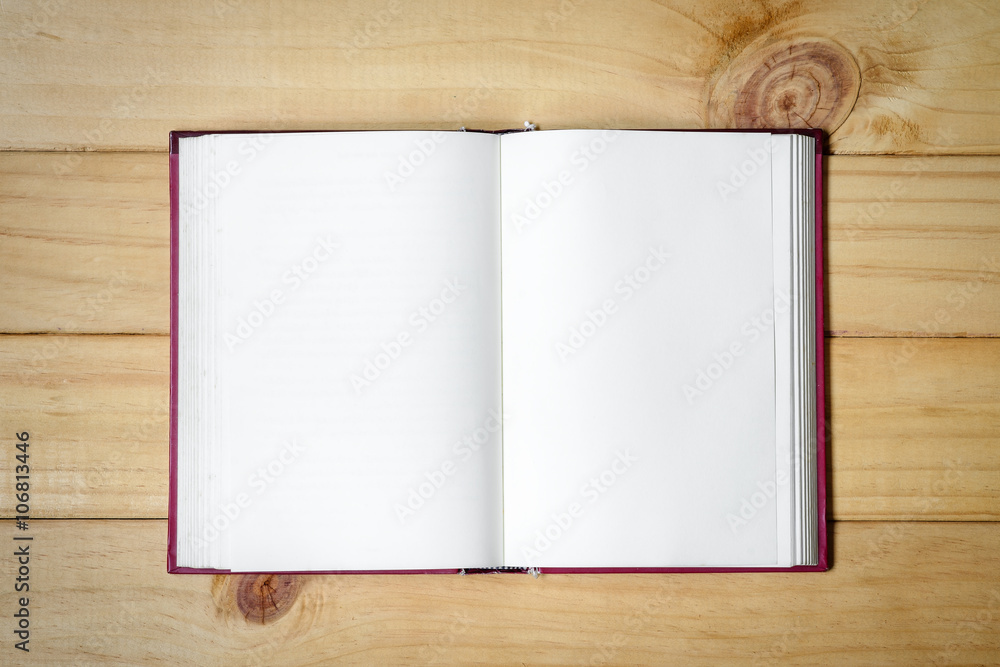 Open blank book on wood background. Open blank book on wood background.