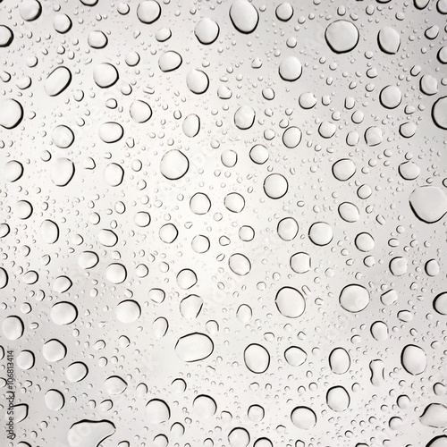 Pattern of raindrops on a glass pane.