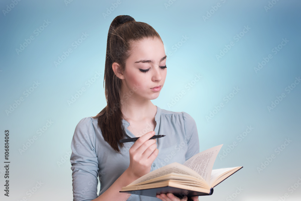 Young beautiful girl reading a book and thinking Young beautiful girl reading a book and thinking