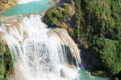 Closeup of powerfull waterfall with turquoise pools