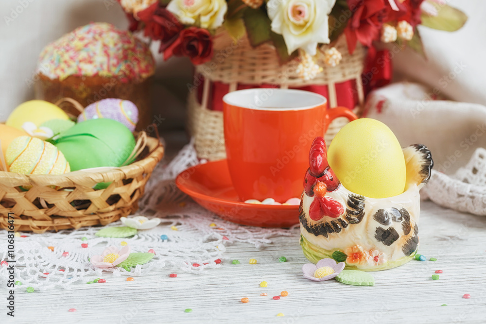 Table setting for Easter - Easter cakes, coffee cup and colored Table setting for Easter - Easter cakes, coffee cup and colored