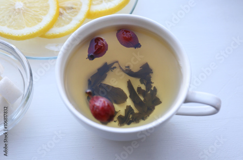 Fotografía Tea set on a white wooden tray, closeup