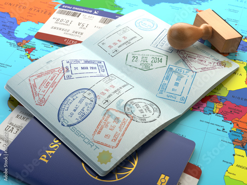 Travel or turism concept. Opened passport with visa stamps with photo