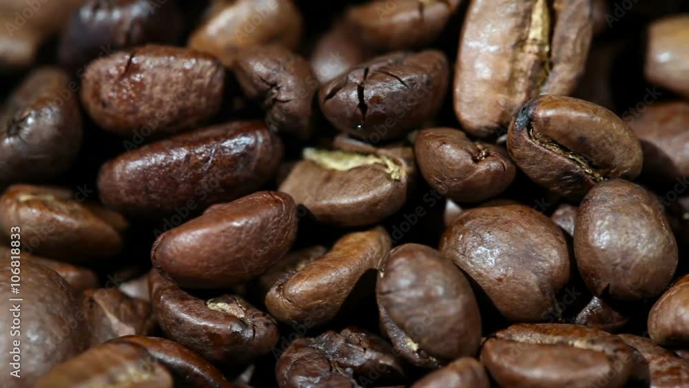 Roasted Coffee Beans on a Table Rotating. Close-up Roasted Coffee Beans on a Table Rotating. Close-up