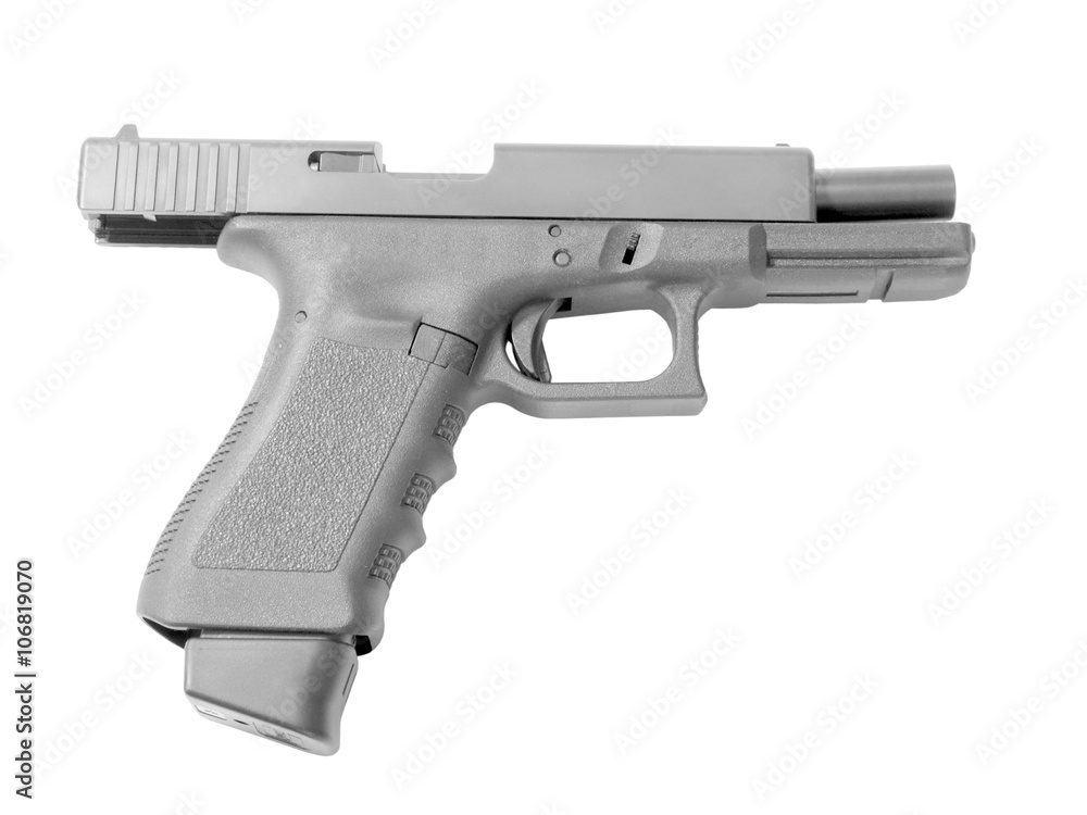 Empty semi-automatic handgun with high capacity magazine isolated on white background.