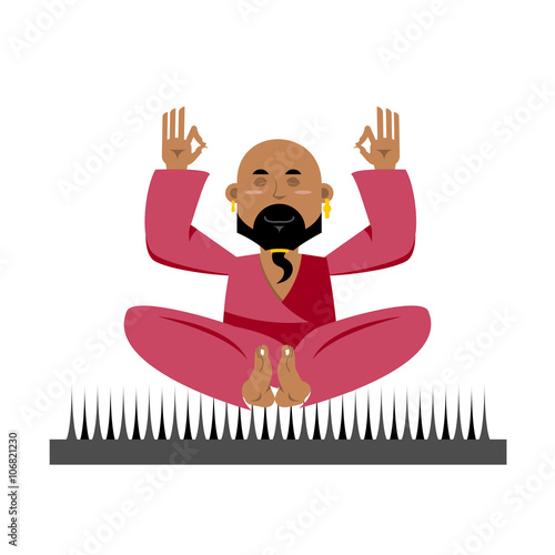 Yogi on nails. Indian yogi sits on spike. nirvana Meditation Yog photo