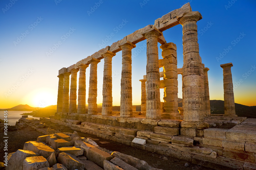Greece. Cape Sounion - Ruins of an ancient Greek temple of Poseidon before sunset - obrazy, fototapety, plakaty 