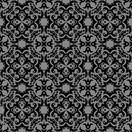 Elegant dark antique background image of round spiral kaleidoscope flower pattern. 