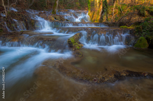 Fototapeta Naklejka Na Ścianę i Meble -  Beautiful waterfalls and mountain stream in Transylvania, in early spring