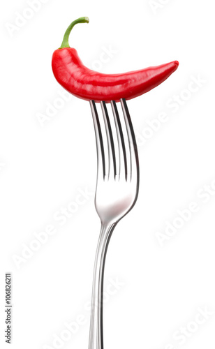 red hot chilli pepper on fork on white background
