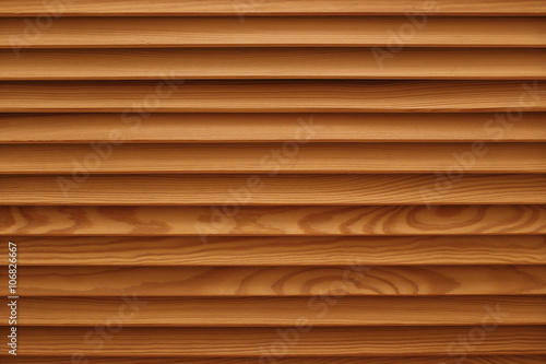Shield with a large number of parallel wooden logs texture. Wood blinds.