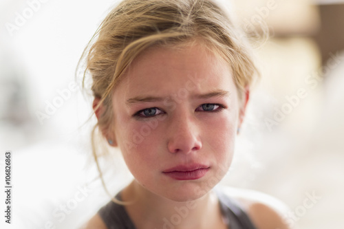Close up of red face of crying Caucasian girl
