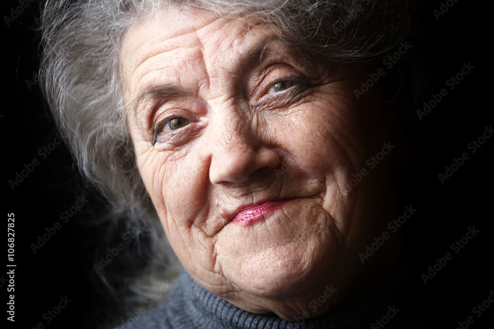 Happy granny face on a black background Happy granny face on a black background