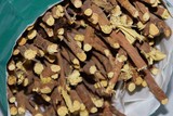 Licorice root sticks lie on a wooden table