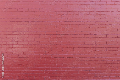 Brick wall with red paint
