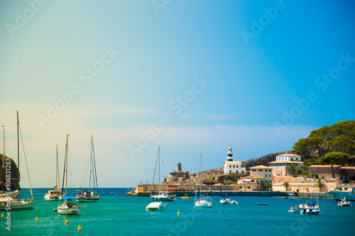 Puerto de Soller, Port of Mallorca island in balearic islands, Spain. Beautiful picture of boats in clear blue water of bright summer day.