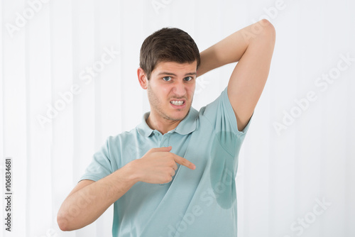 Man Pointing To A Sweat Armpit photo