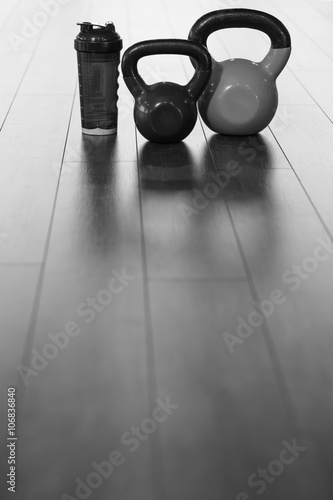 Fototapeta Naklejka Na Ścianę i Meble -  exercise weights - iron dumbbell with extra plates on a wooden d
