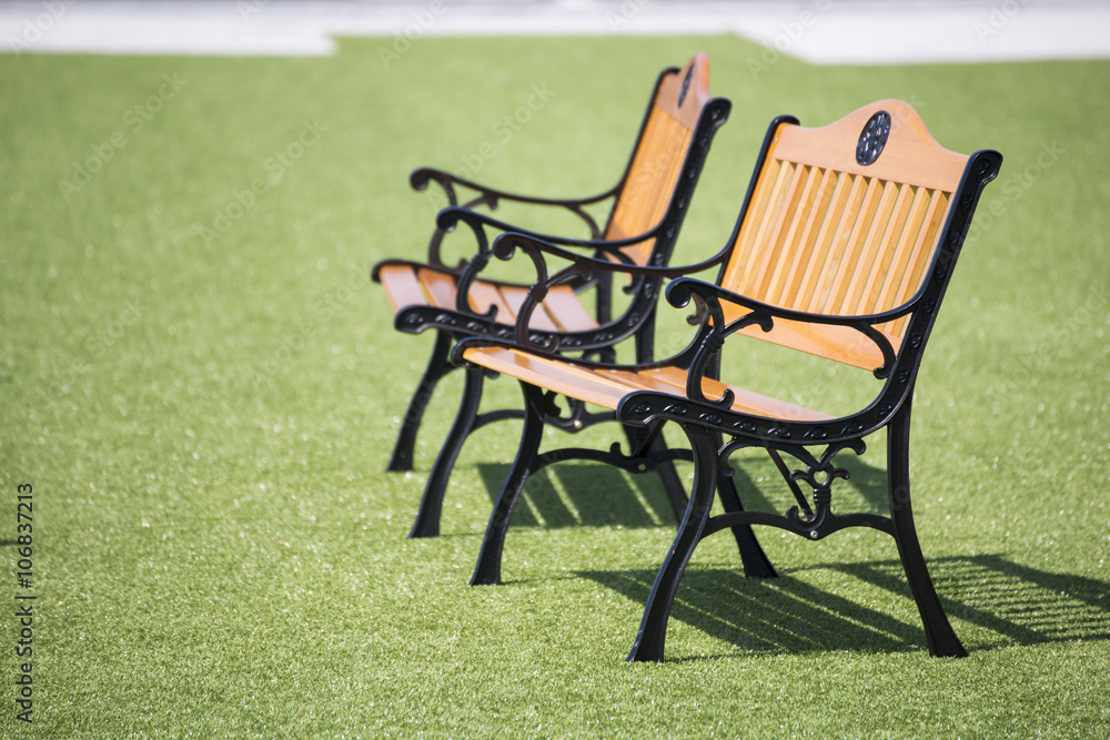 wooden chairs on the green grass wooden chairs on the green grass