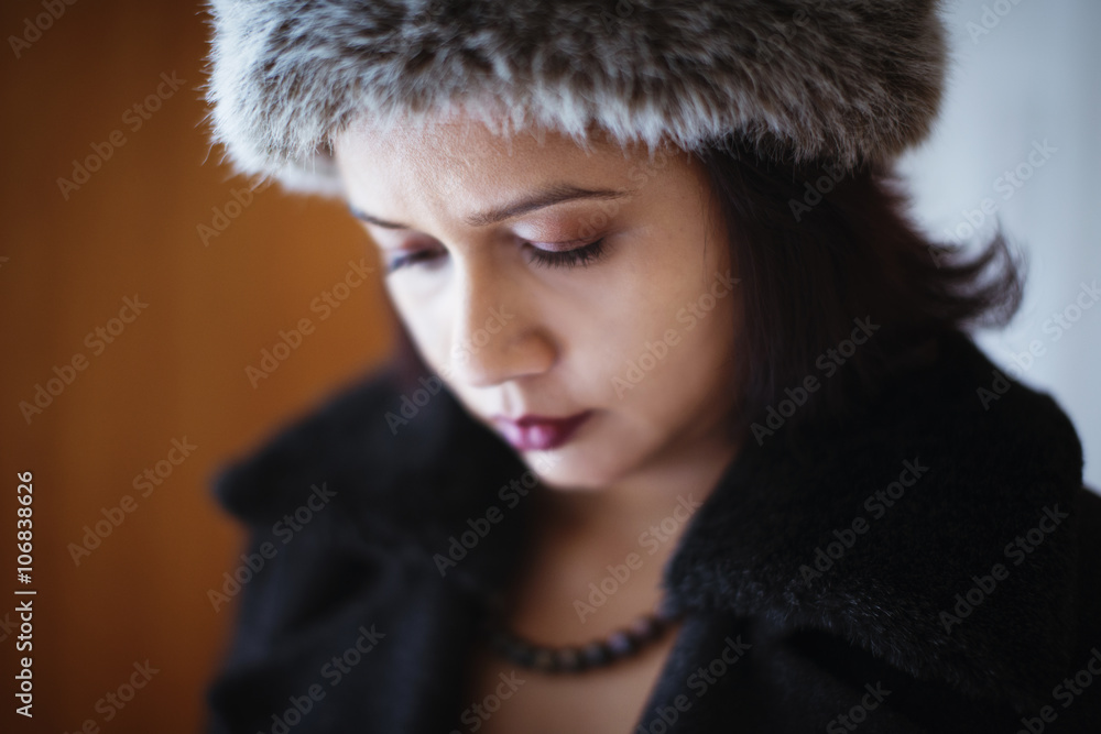 Mixed race woman wearing furry hat and coat Mixed race woman wearing furry hat and coat