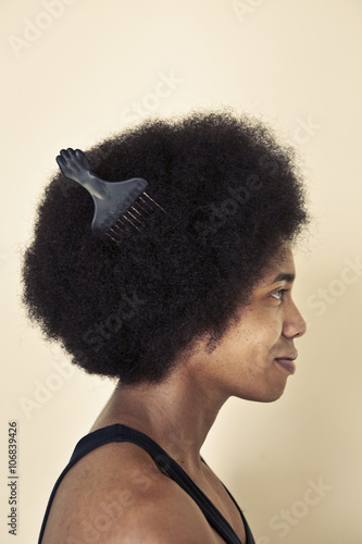 African American man wearing comb in afro hairstyle photo