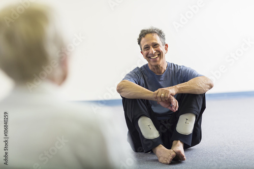 Teacher smiling at student in acting class