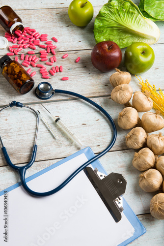healthcare concept balance between medicine and healthy foods