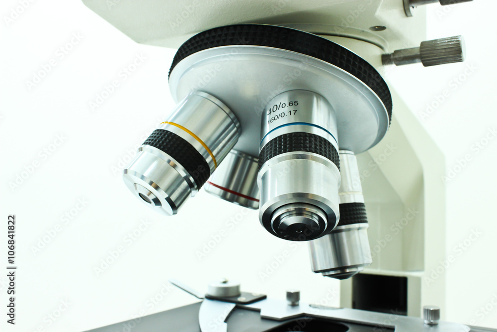 Objective Lens of Microscope Isolated on the White Background Objective Lens of Microscope Isolated on the White Background