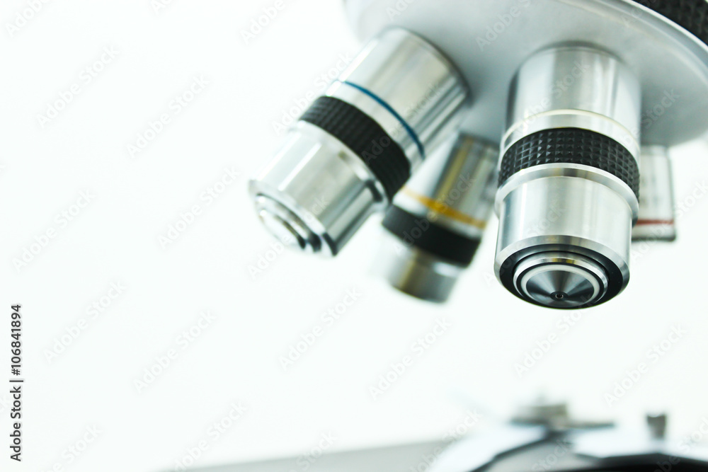 Objective Lens of Microscope Isolated on the White Background Objective Lens of Microscope Isolated on the White Background
