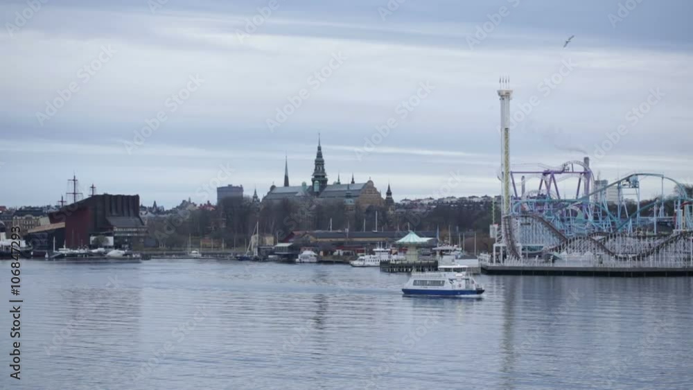 View of Stockholm city harbor and park from a cruise ship across the water View of Stockholm city harbor and park from a cruise ship across the water
