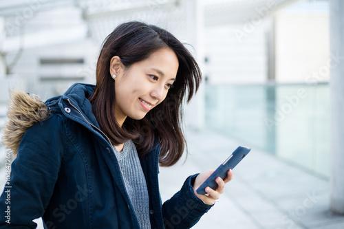 Woman use of mobile phone in Hong Kong city