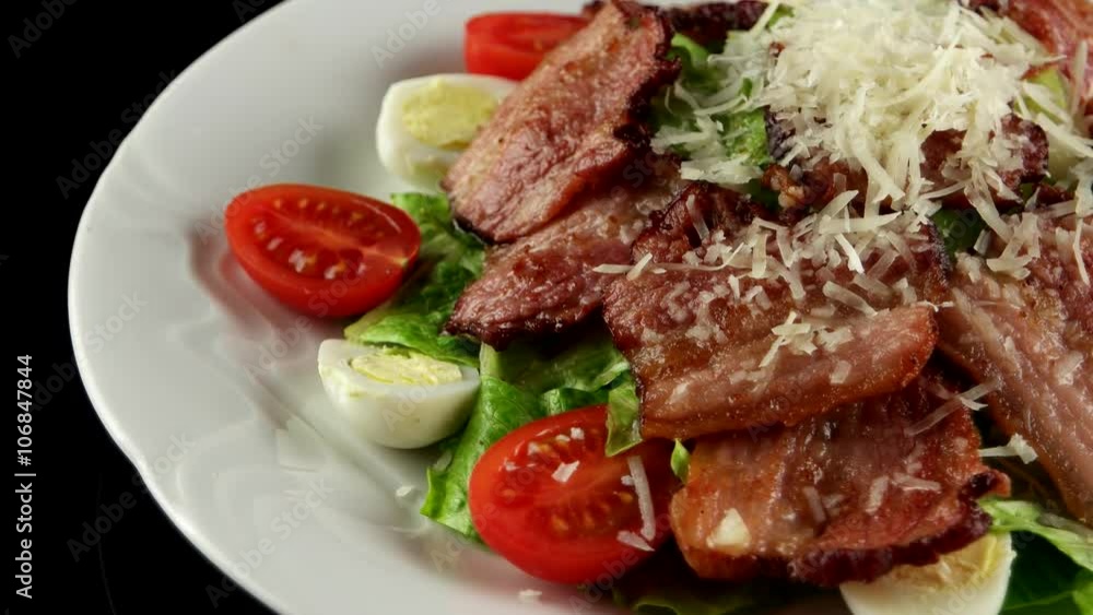 Warm salad with bacon, quail eggs, and Parmesan cheese, loop
Warm salad with bacon, quail eggs, and Parmesan cheese, loop