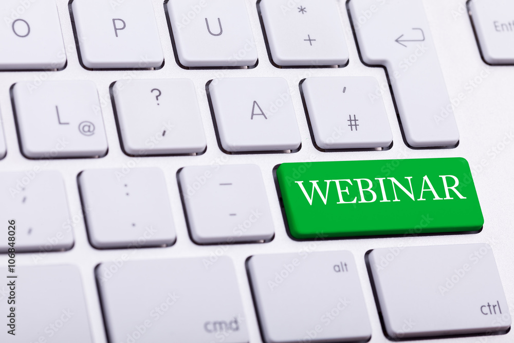 Keyboard with webinar word in green button Keyboard with webinar word in green button