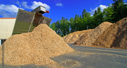 bio fule (biomass) storage of against blue sky photo