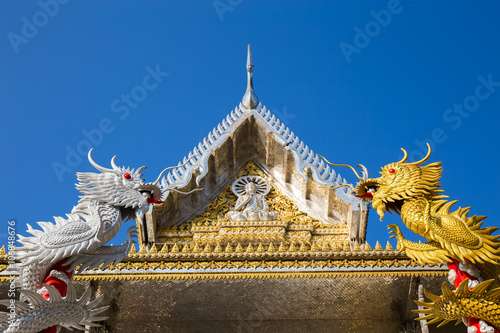 Silver and Gold Dragon entwine temple pole at Wat Muang - Ang Th
