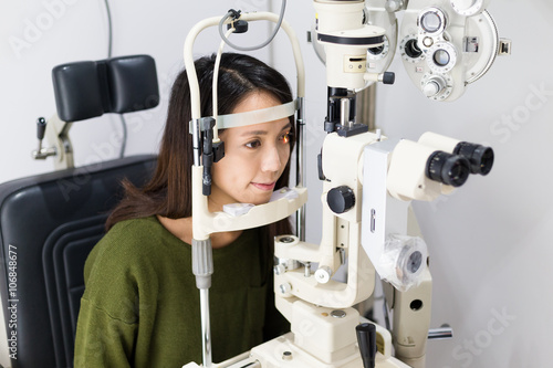 Patient doing eye exam in medical office