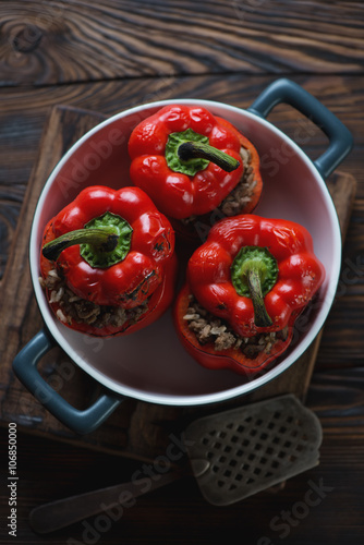 Baking dish with stuffed bell peppers, high angle view, close-up