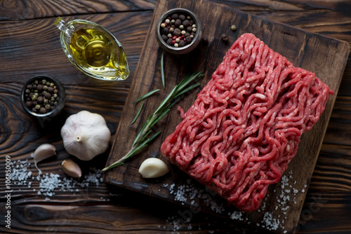 Top view of fresh beef mincemeat with seasonings, studio shot