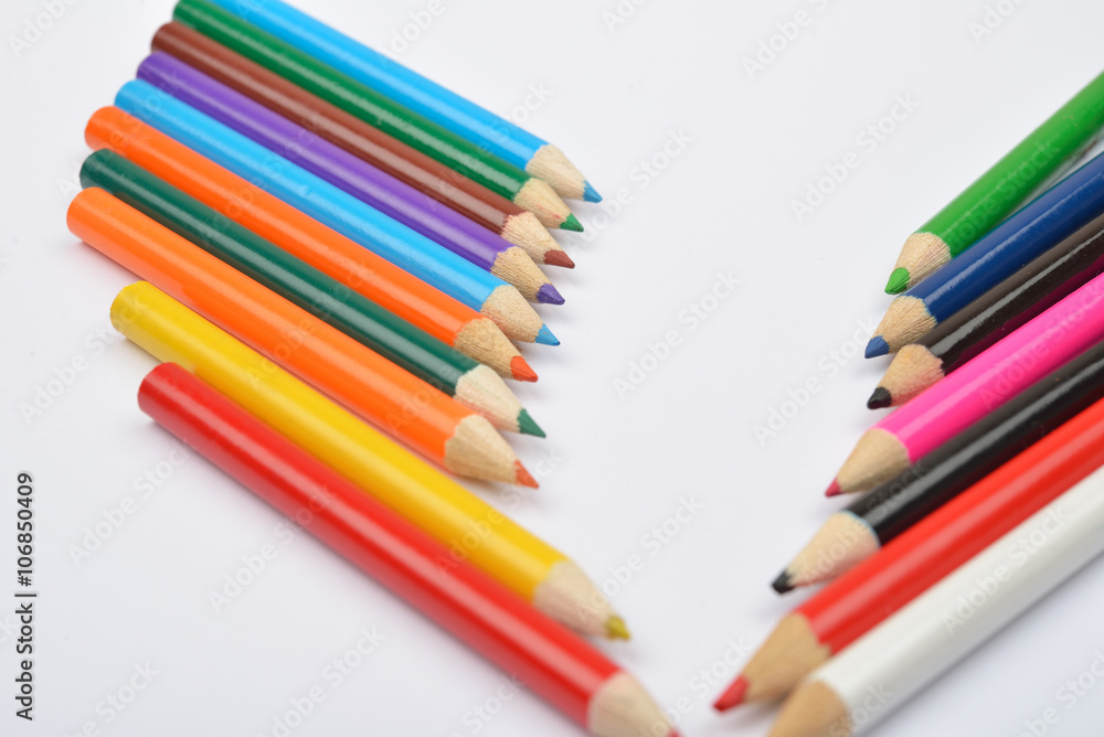 Close up picture of many little colored pencil crayons on white Close up picture of many little colored pencil crayons on white