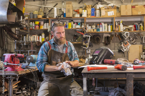 Caucasian craftsman working in workshop