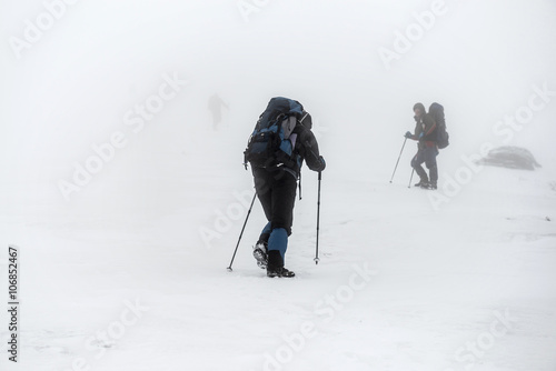 Mountain hiking group in snow storm