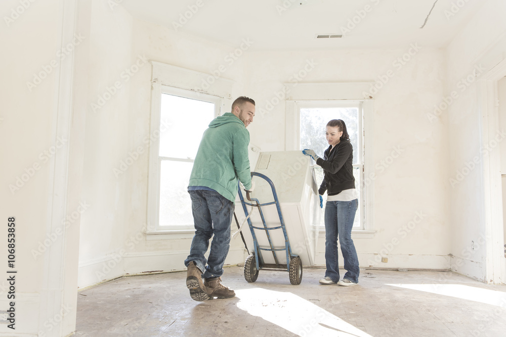 Mixed race couple moving into new home Mixed race couple moving into new home