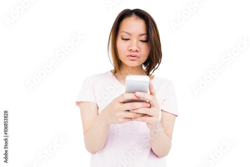 Young woman text messaging on mobile phone