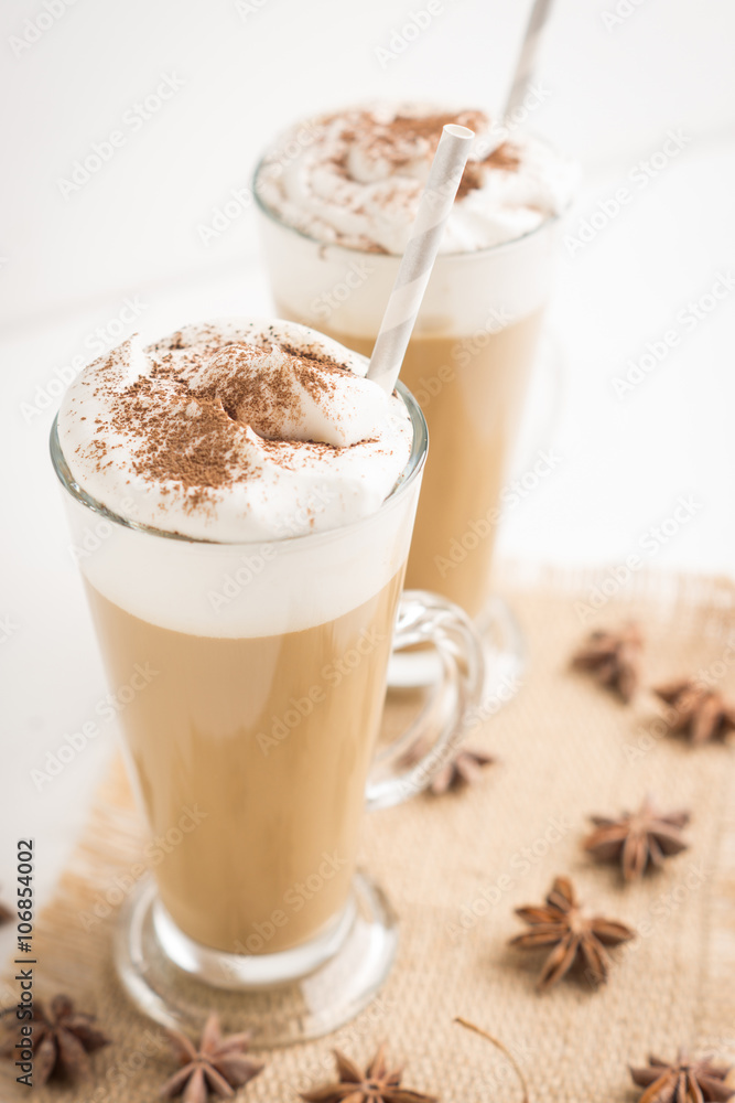 Coffee in glass on the wooden background Coffee in glass on the wooden background