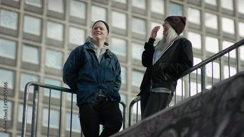 Two laughing skaters