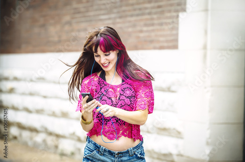 Caucasian woman using cell phone outdoors