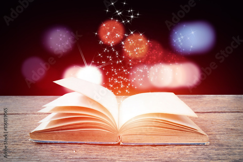 Abstract magic book on wooden background