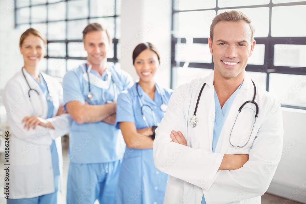 Portrait of medical team standing together with arms crossed Portrait of medical team standing together with arms crossed