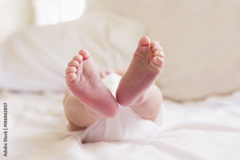 Close up of feet of mixed race baby Close up of feet of mixed race baby