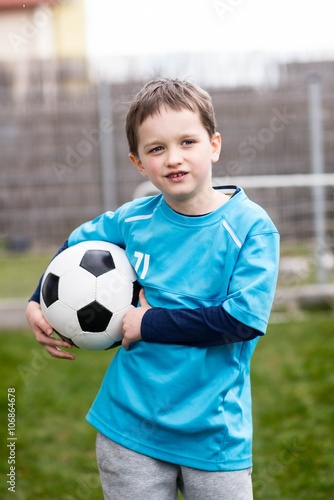 7 years boy - footballer with football ball. © Daniel Jędzura